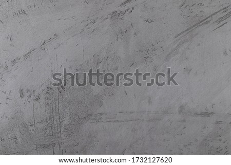 Artistic gray wet concrete crack background with spots and blotc