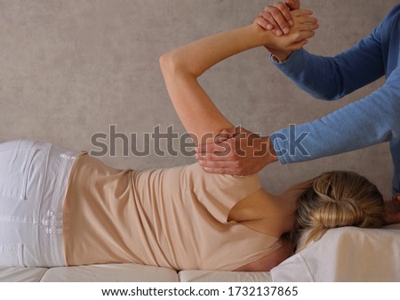 Woman having Chiropractic Back Adjustment / Physiotherapy Treatment . Scoliosis Posture Correction for Female Patient . Royalty-Free Stock Photo #1732137865