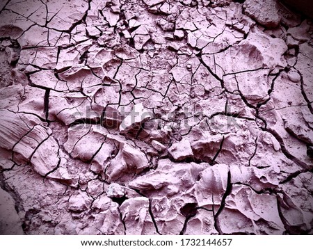 A picture of dry earth or dry soil in a summer time in Thailand. An abstract nature. Drought crisis.