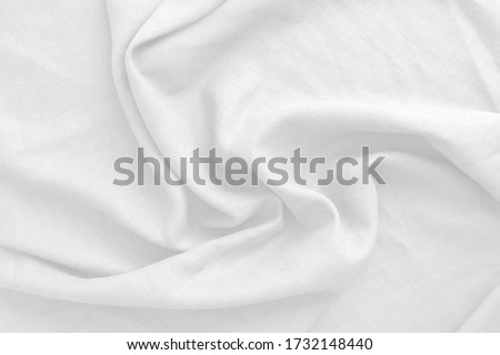 Cotton white fabric texture, abstract. It has a soft look that like a wave suitable for background, backdrop. Royalty-Free Stock Photo #1732148440