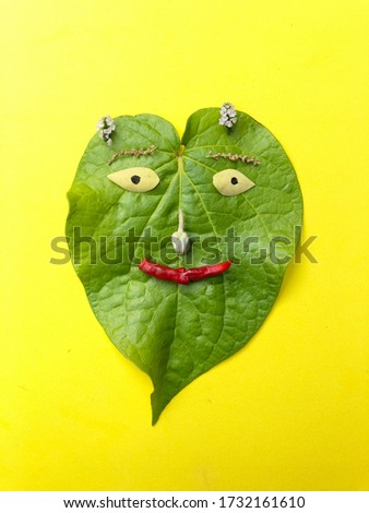 Beautiful crafting of a betel leaf representing a human face