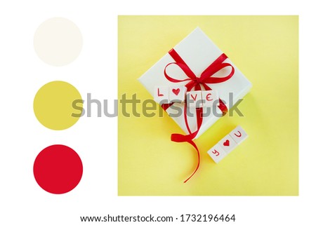 Isolated gift box with "Love you" on text yellow background  in a colour palette, with complimentary colour swatches
