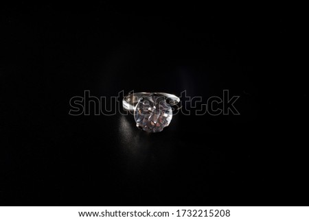 wedding ring on black background
