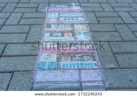 drawing of an apartment building on the asphalt with chalk