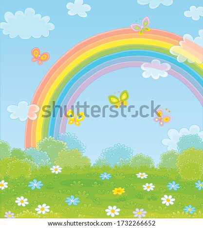 Colorful rainbow in the blue sky and cheerful butterflies flittering over a green field with beautiful flowers on a pretty summer day after warm rain, vector cartoon illustration