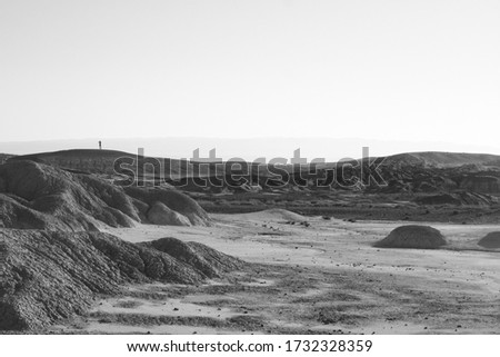 Human silhouette on the top of the hill, background