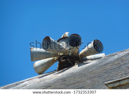 Old siren on the roof with gull, Etretat / France