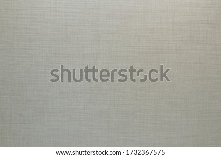 Light laminated panel with linen texture, background.