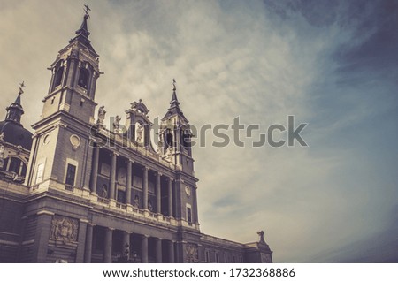 A low angle shot of the beautiful Catedral de la Almudena under the cloudy sky in Madrid, Spain