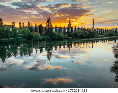 The sky reflected in the lake at sunset. Clear water in Nature that reflects the sky.
