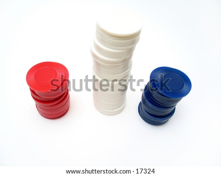 Red and blue poker chips stacked together on a white background.