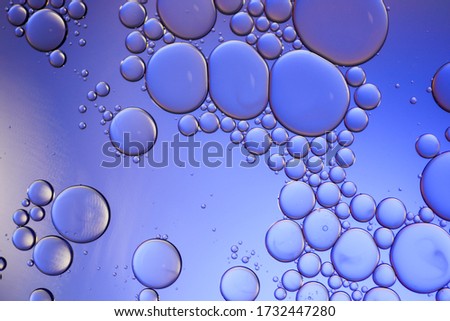 Colorful artistic of oil drop floating on the water.
