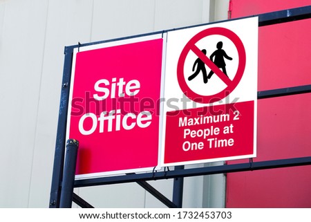Social distancing sign at building site work office sign