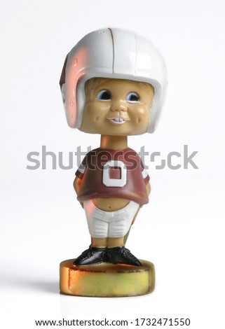 A vintage football player bobble head doll. Royalty-Free Stock Photo #1732471550