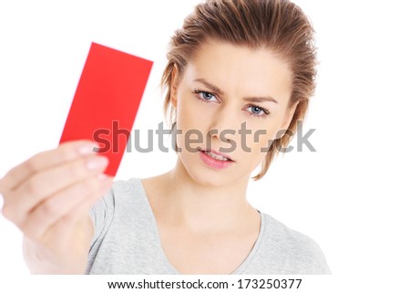 A picture of a serious woman showing a red card over white background