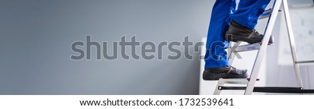 Man In Shoes On Step Ladder. Work Safety Royalty-Free Stock Photo #1732539641