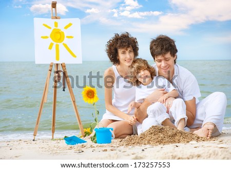 Happy family having fun on sea beach