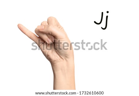 Woman showing letter J on white background, closeup. Sign language