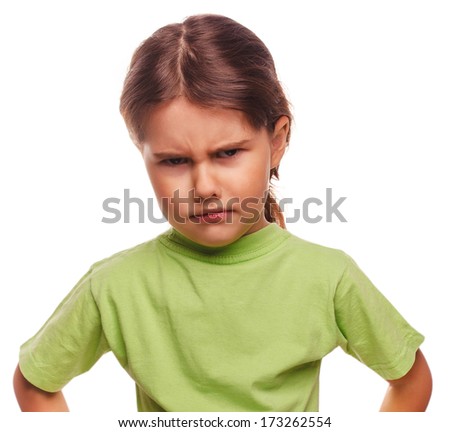 Angry evil girl shows fists experiencing anger and isolated on white background large
