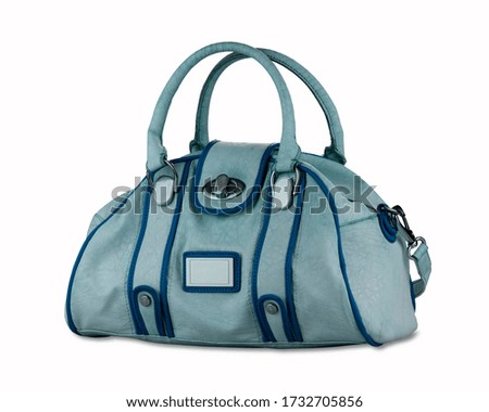 Stylish sky blue leather elegant women bag with navy elements. Fashionable female handbag, isolated on white background