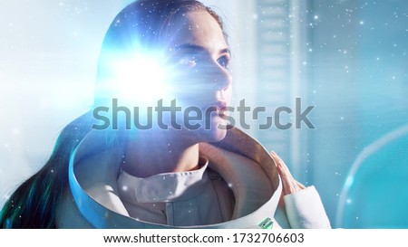 inner universe, a concept of human consciousness and intelligence. A young woman in a space suit and a galaxy in her brain, double exposure Royalty-Free Stock Photo #1732706603
