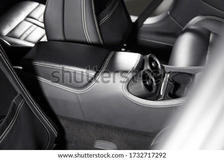 A closeup shot of interior details of a modern luxury car