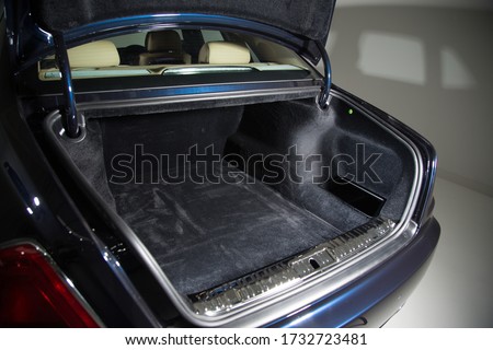A high angle shot of the open empty trunk of a car