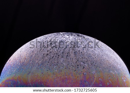 Soap bubble isolated on black