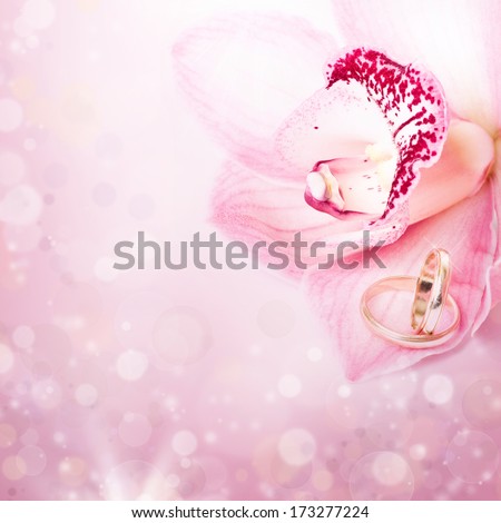 Pink orchid and wedding ring 