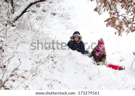 Two little girls having fun in winter