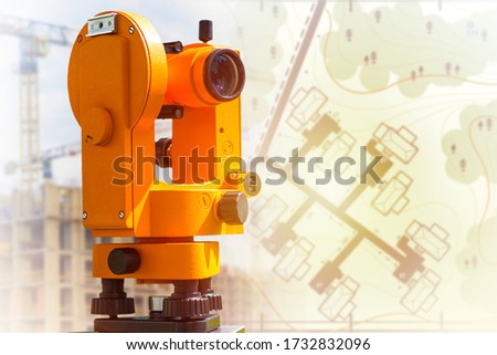 Map equipment close-up. Cartography and geodesy. Creating updated maps of the area. Work of the cartographer. Drawing of houses on the plans. Royalty-Free Stock Photo #1732832096