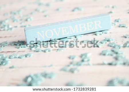 The month of November is written on a wooden bar. Background for the calendar.