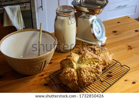 Home baking. Traditional Irish soda bread in a home kitchen setting. Royalty-Free Stock Photo #1732850426