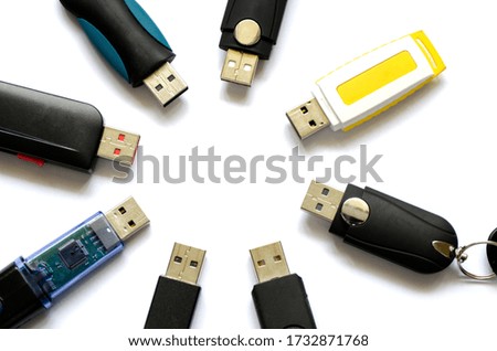 Selection of USB thumb drives (memory sticks) on a white background