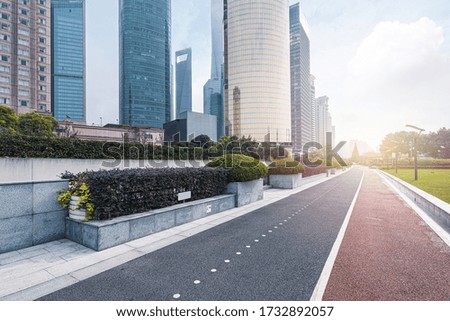 empty footpath with nobody and skyscrapers in the city of shanghai.
