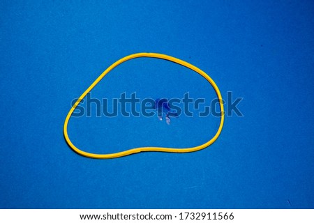 yellow elastic, and blue background