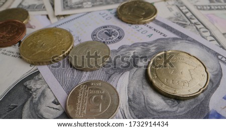 Extreme Close-Up shot of rotating euro and dollar banknotes. Shot was taken in 8K