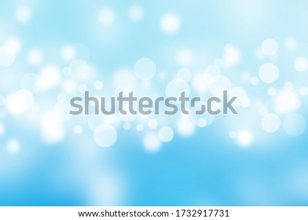 Abstract bright bokeh on blue sky blurred background. Royalty-Free Stock Photo #1732917731