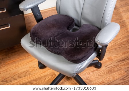 A view of a seat cushion on an office chair. Royalty-Free Stock Photo #1733018633