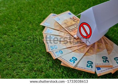 Real estate management. A conceptual house on top of 50 euro bills. Conceptual photography.