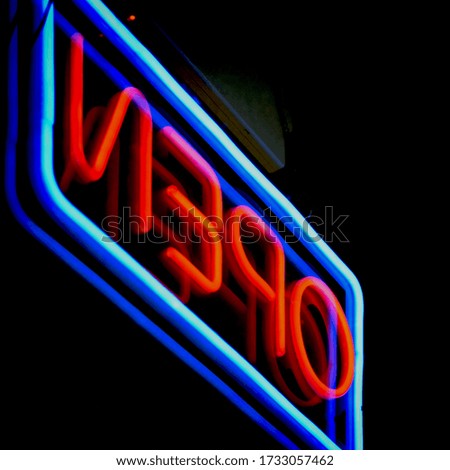 Blue and red Neon OPEN sign.
