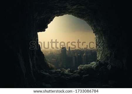 Vintage cave with a crowded city view 