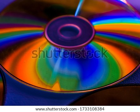 Shiny disk reflecting a rainbow 