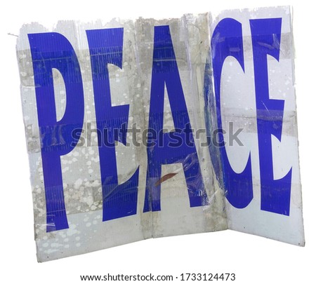 Grungy weathered PEACE sign mounted on foam board and held together with clear tape.                       