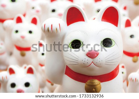 Maneki-neko,
Cat figurine to invite people and money Royalty-Free Stock Photo #1733132936