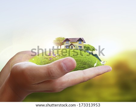 Business man house in human hands  Royalty-Free Stock Photo #173313953