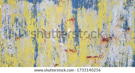 Stylish background from old layers of paint, scuffs, stains, rust.