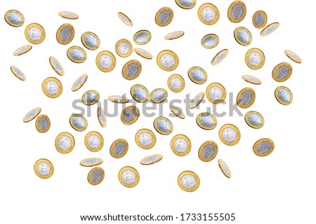 Falling one brazilian real coins isolated on white background