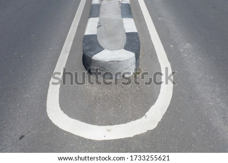 Closeup Image of Concrete Street Block. Concrete Traffic Divider. 
