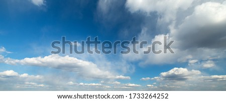 white clouds in the vast bright blue sky.Panorama.